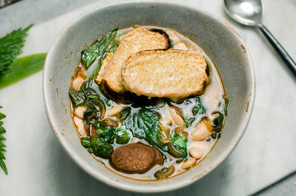 Wild garlic, nettle and chorizo soup with Butter beans, toasted sourdough and Barber's cheddar